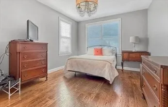 a bedroom with a bed and a dresser