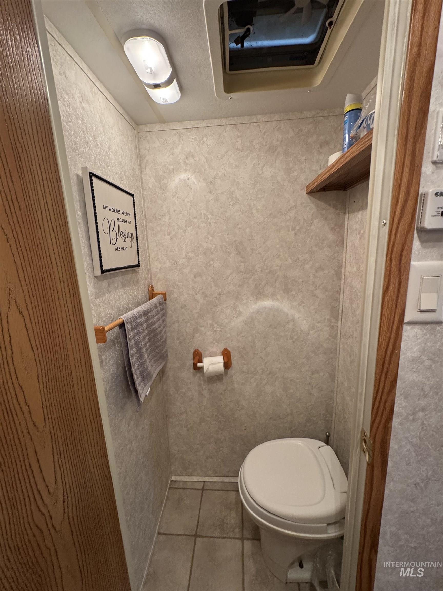 29 B Street Cascade, ID 83611 - Photo 12 of 24 Bathroom featuring toilet and tile patterned flooring