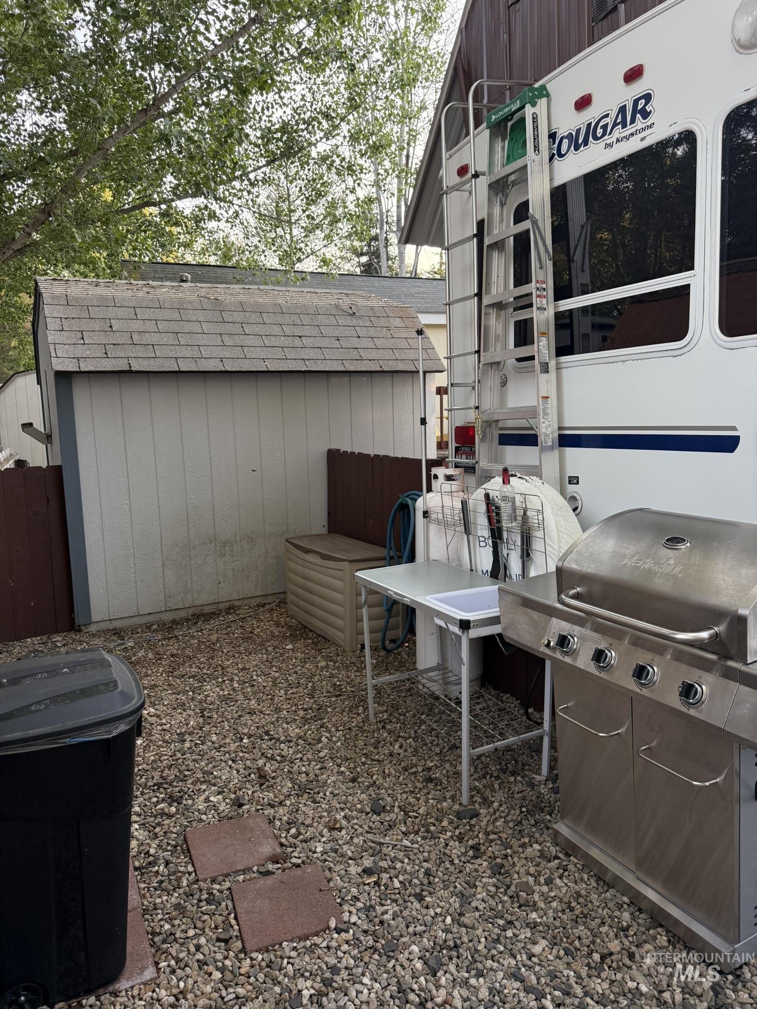 29 B Street Cascade, ID 83611 - Photo 14 of 24 View of patio / terrace with area for grilling and a shed