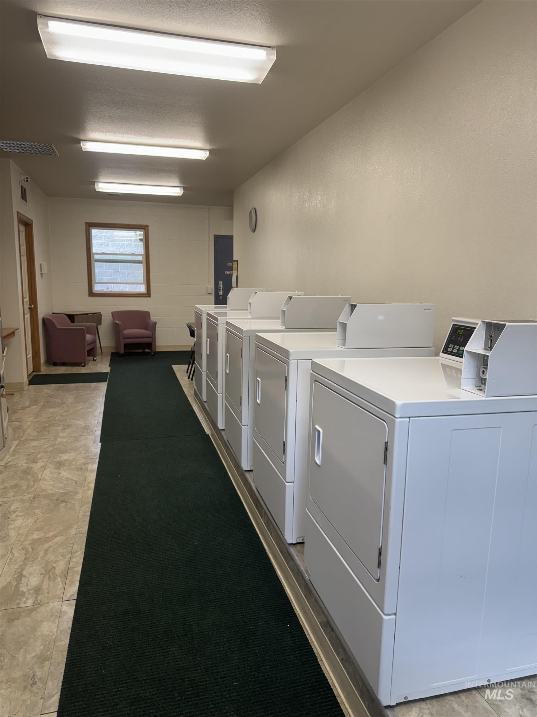 29 B Street Cascade, ID 83611 - Photo 16 of 24 Community laundry room featuring washing machine and clothes dryer