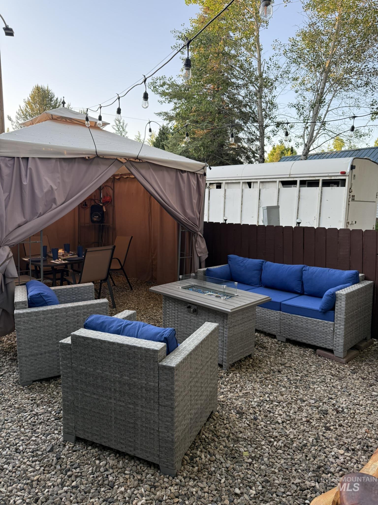 29 B Street Cascade, ID 83611 - Photo 17 of 24 View of patio / terrace featuring an outdoor living space, a gazebo, and outdoor dining area