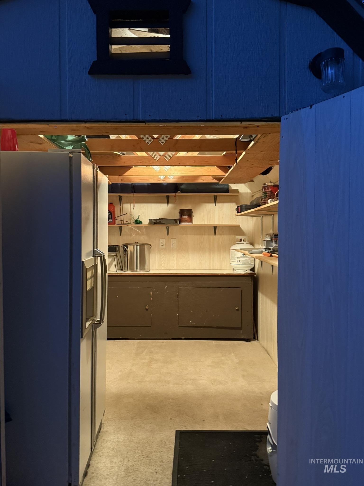 29 B Street Cascade, ID 83611 - Photo 6 of 24 Kitchen with fridge with ice dispenser and concrete flooring