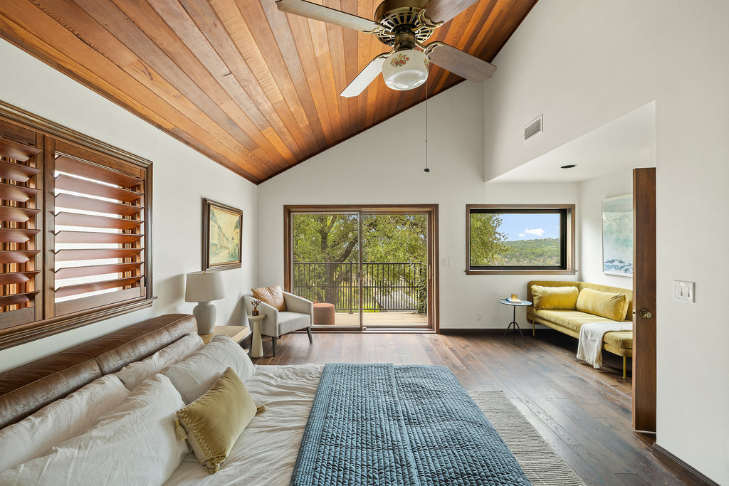 1922 Cypress Point West Austin, TX 78746 - Photo 20 of 38 a living room with furniture and a large window