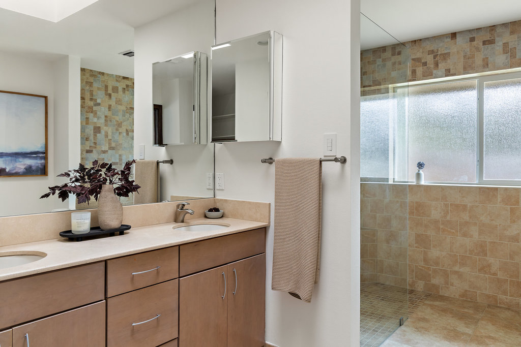 1922 Cypress Point West Austin, TX 78746 - Photo 21 of 38 a bathroom with a double vanity sink and mirror