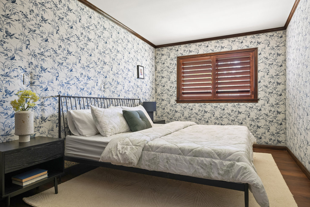 1922 Cypress Point West Austin, TX 78746 - Photo 23 of 38 a bedroom with a bed and a window