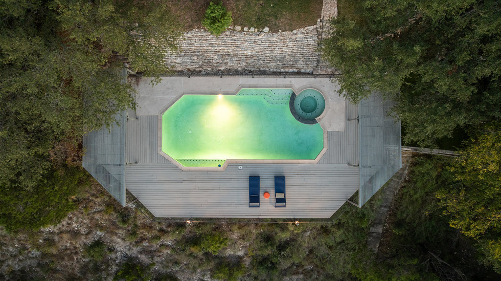 1922 Cypress Point West Austin, TX 78746 - Photo 34 of 38 an aerial view of a house with a swimming pool and a yard