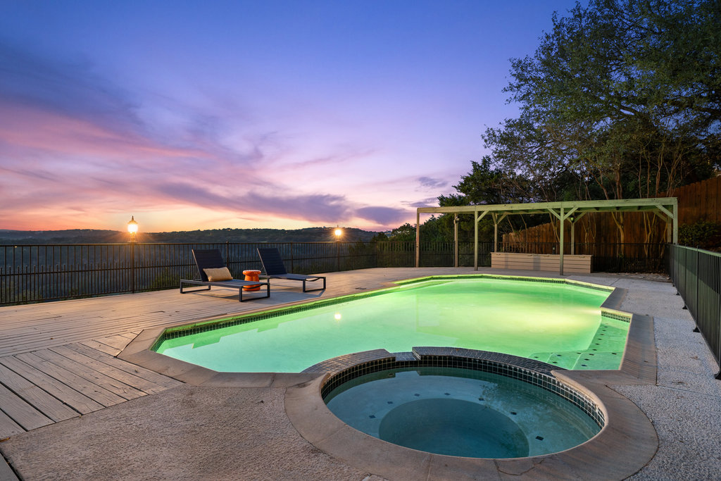 1922 Cypress Point West Austin, TX 78746 - Photo 4 of 38 a view of a swimming pool with a yard