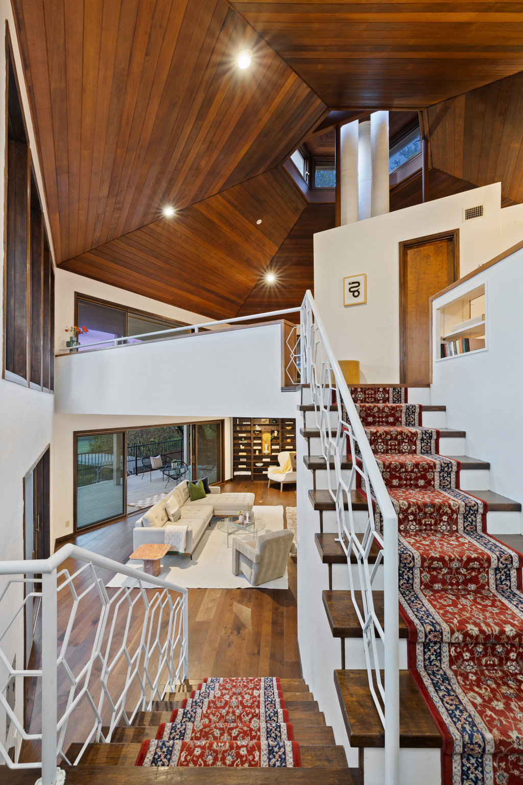 1922 Cypress Point West Austin, TX 78746 - Photo 6 of 38 a bed room with a bed and a book shelf