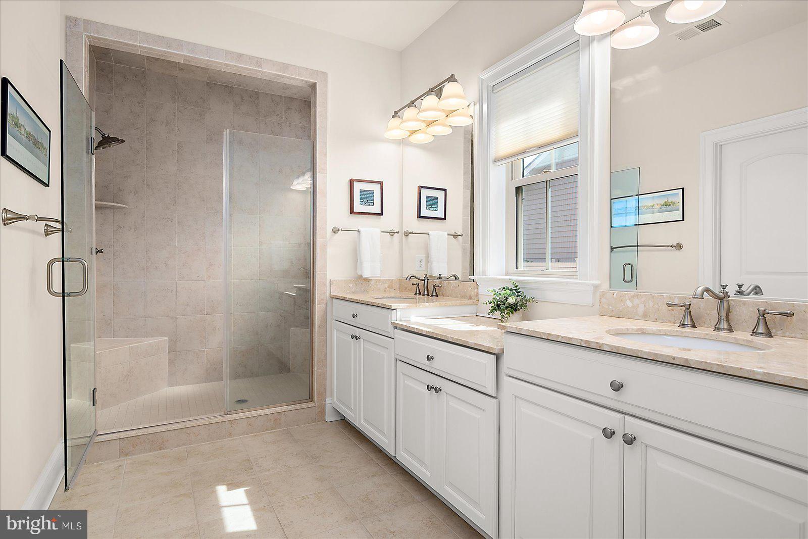 30561 Silverton Road Frankford, DE 19945 - Photo 25 of 60 a bathroom with a granite countertop sink mirror and double