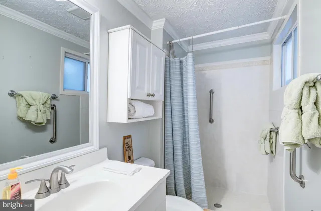 a living room with lots of furniture and a large window