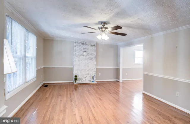 a view of front door with wooden floor