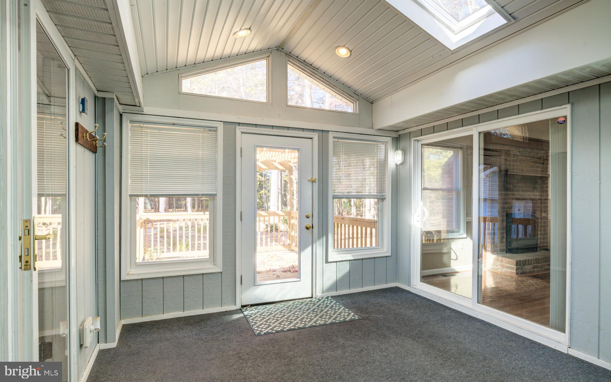 9 Burr Hill Drive Ocean Pines, MD 21811 - Photo 57 of 82 3 Season room with door to Primary bedroom area