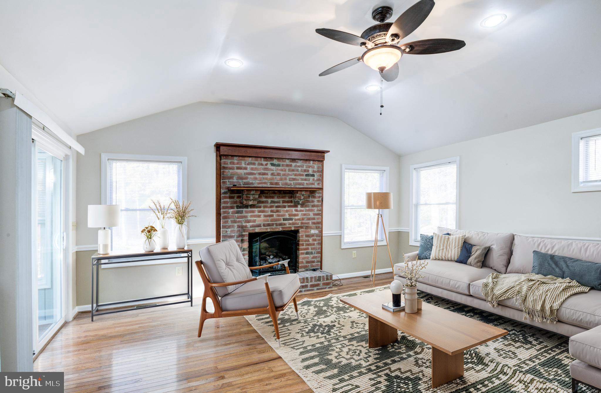 9 Burr Hill Drive Ocean Pines, MD 21811 - Photo 71 of 82 a living room with furniture and a fireplace