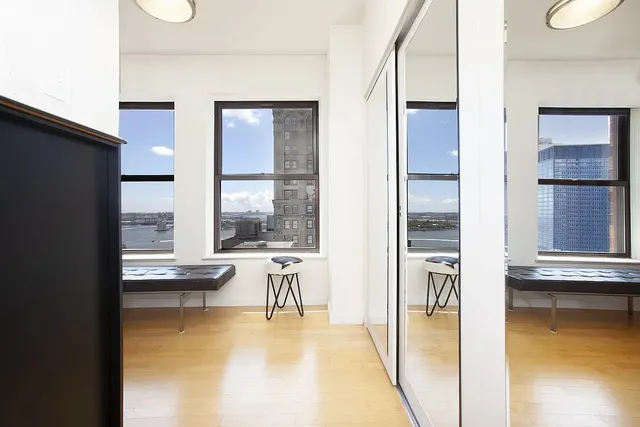 a view of kitchen and dining area with chandelier