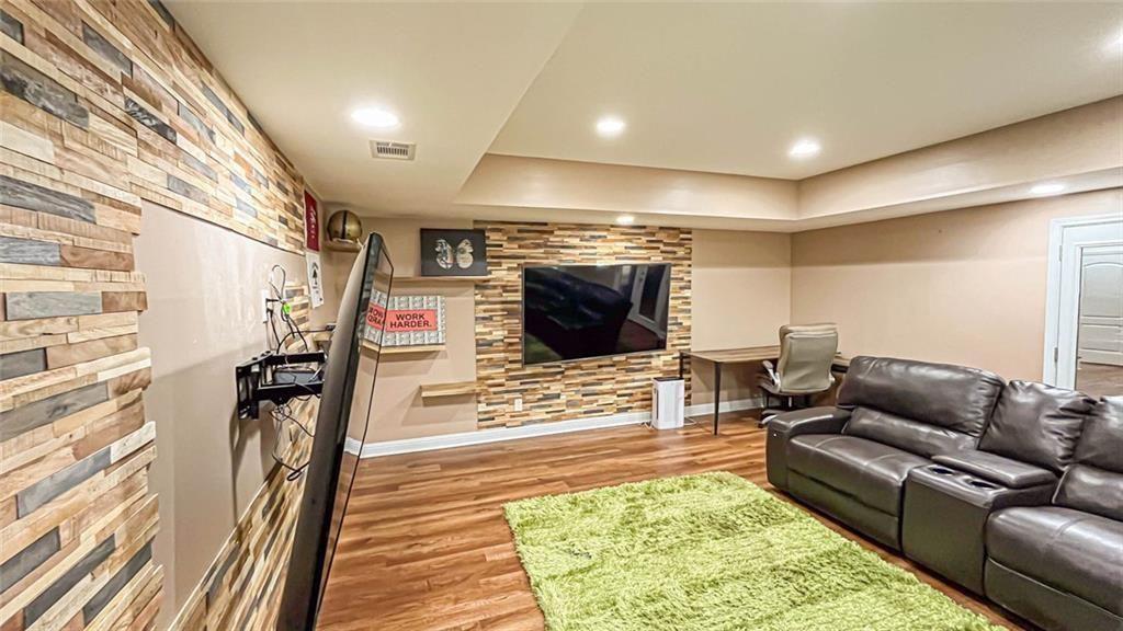 3281 Alhambra Circle Hampton, GA 30228 - Photo 63 of 88 a living room with furniture and a flat screen tv