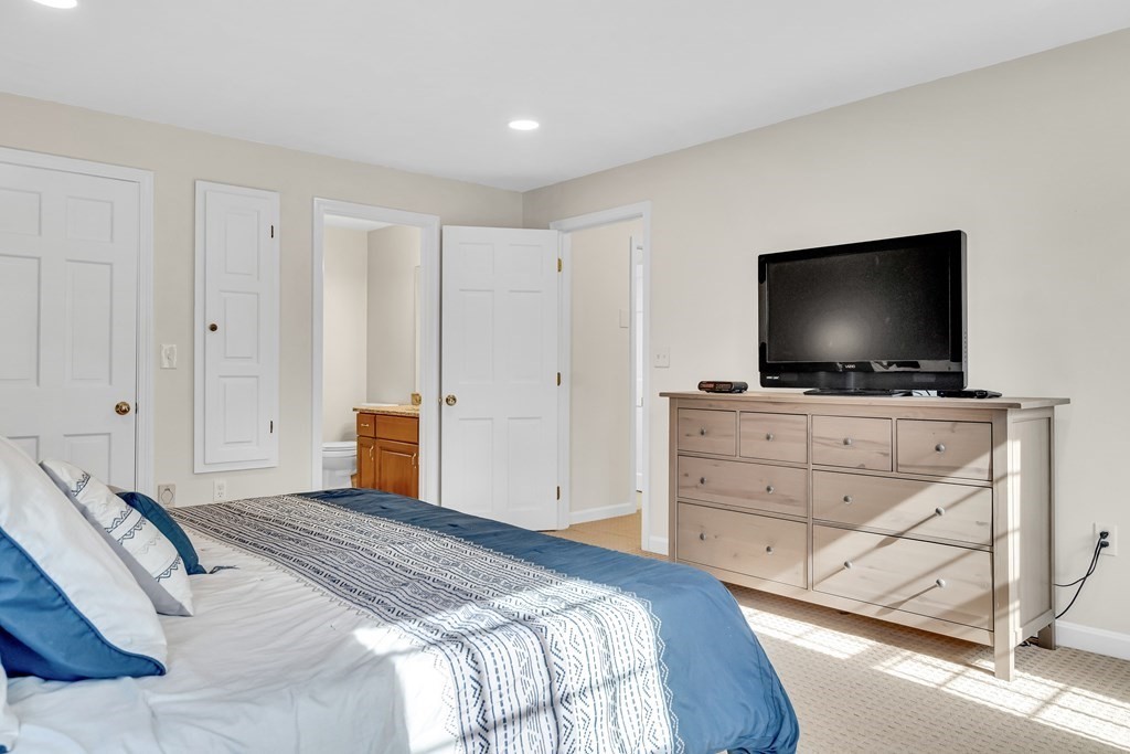 52 Oregon Road Southborough, MA 01772 - Photo 28 of 42 a bedroom with a flat screen tv on the dresser and a flat screen tv