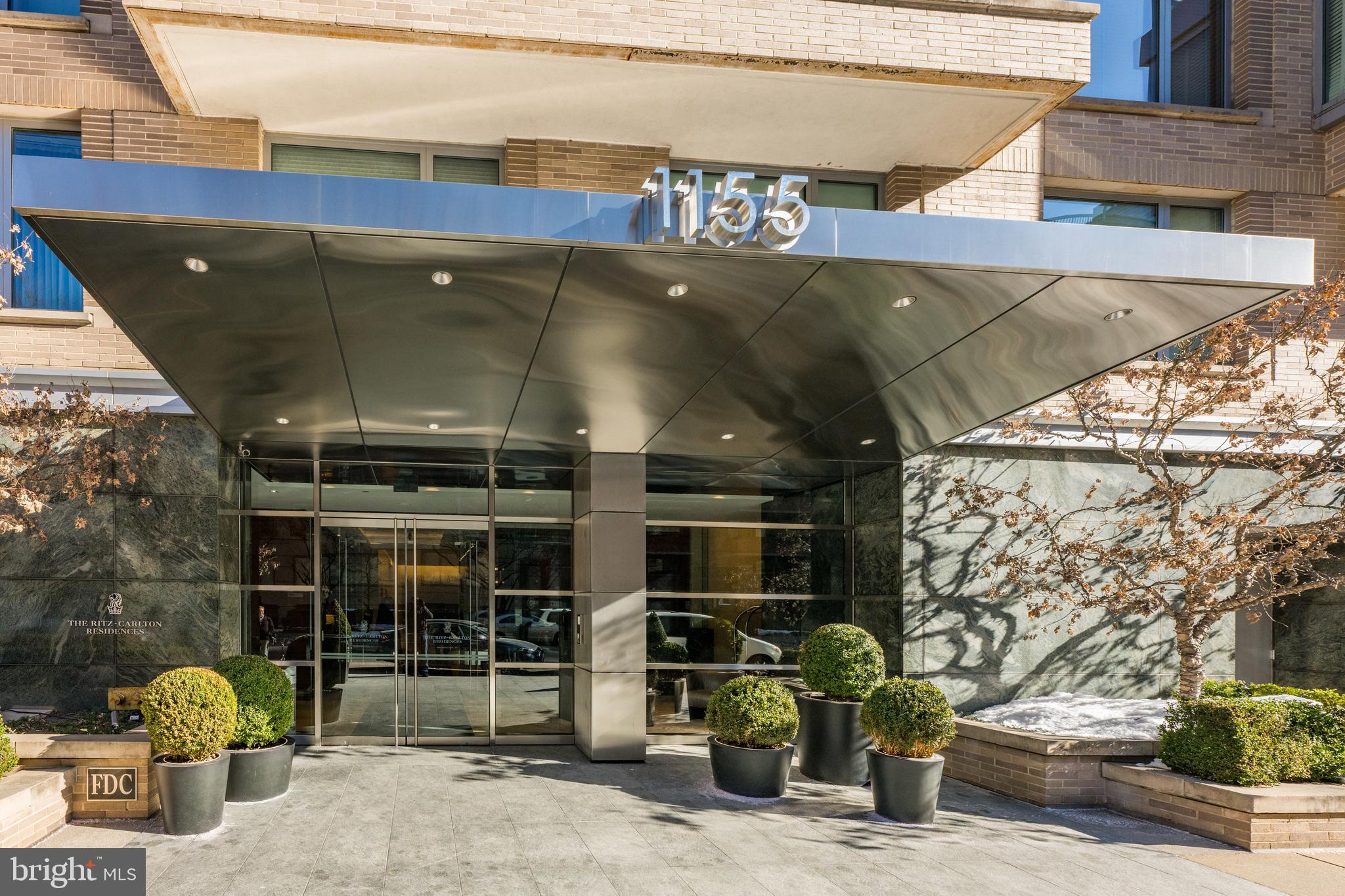 1155 23rd Street Northwest, Unit 6C Washington, DC 20037 - Photo 3 of 32 a front view of a building with street