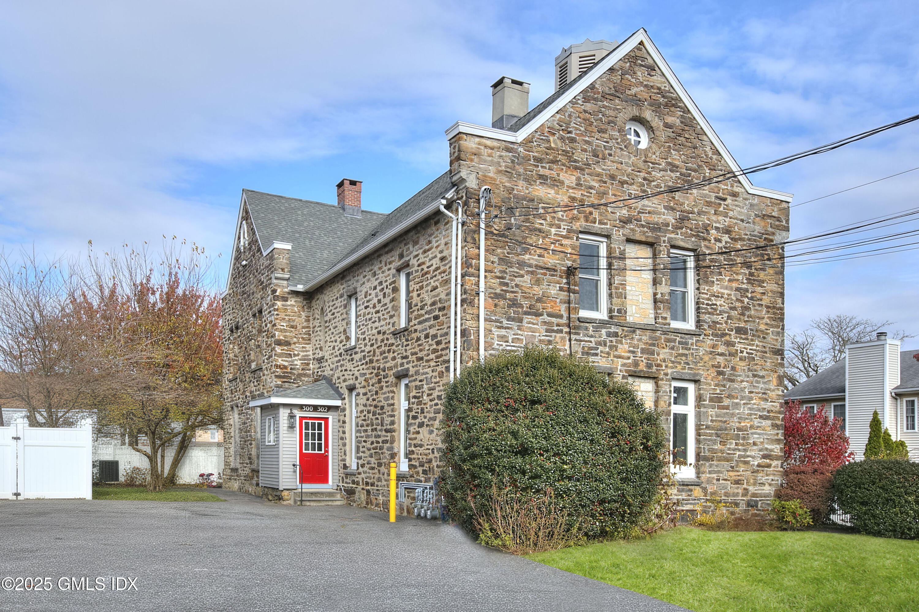 300 Soundview Avenue, Unit DUPLEX Fairfield, CT 06825 - Photo 1 of 27 a front view of a house with a garden