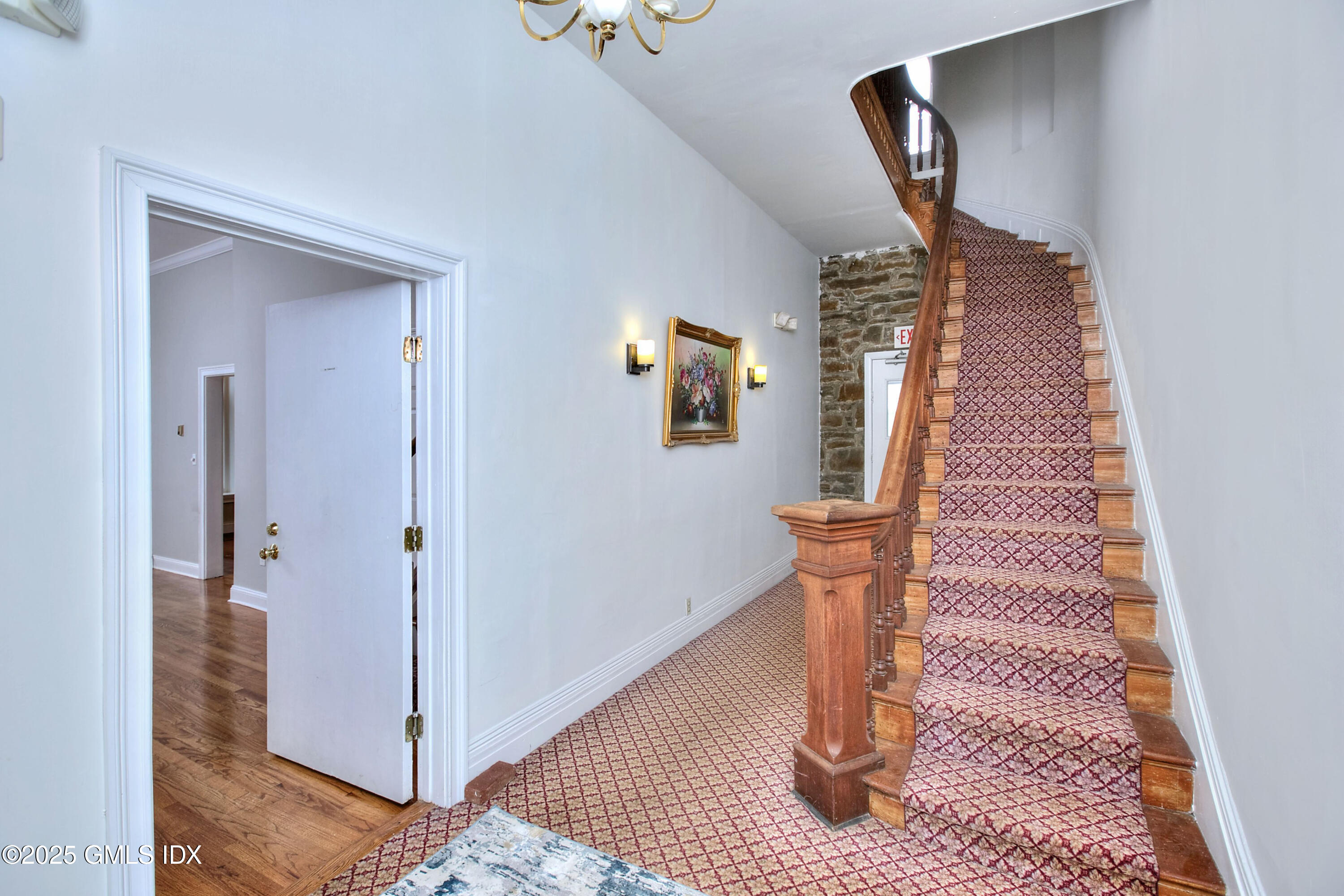 300 Soundview Avenue, Unit DUPLEX Fairfield, CT 06825 - Photo 16 of 27 a view of a hallway view with staircase