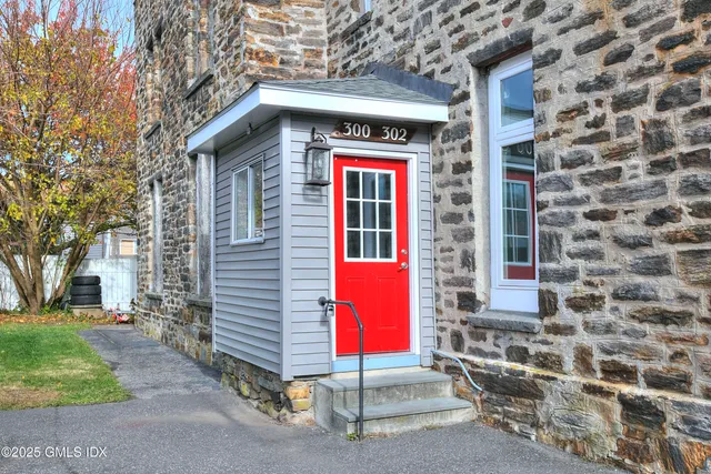 a view of a backyard with large trees