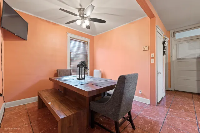 a dining room with furniture and window