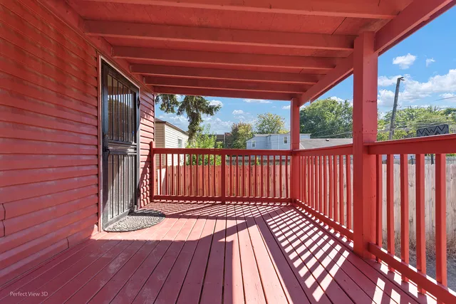 a view of porch with wooden floor