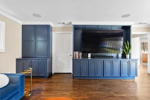 a view of kitchen with furniture and wooden floor