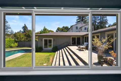 a view of swimming pool with a patio