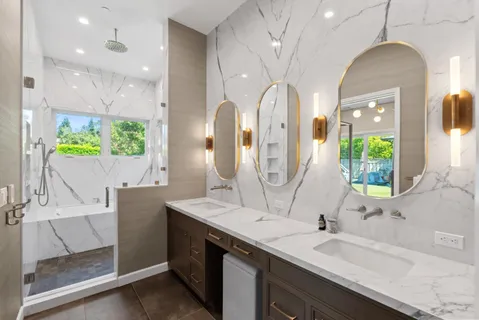 a bathroom with a double vanity sink and a mirror