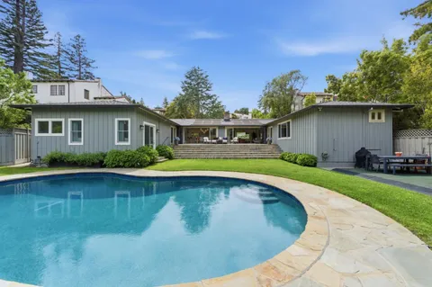 a view of a house with swimming pool