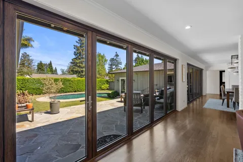 a view of a big room with wooden floor and outdoor seating