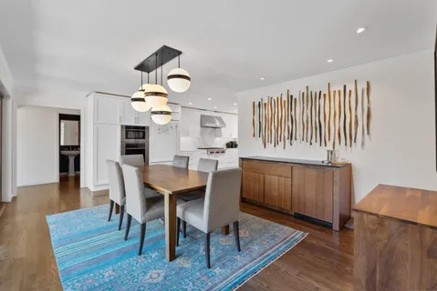 a view of dining room and wooden floor