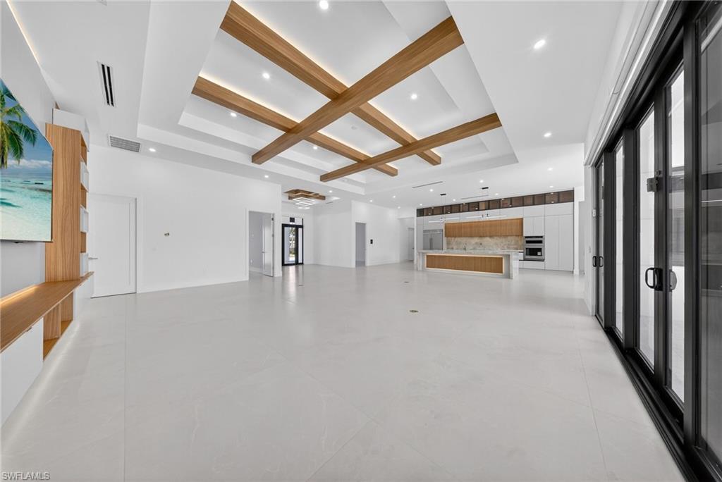 1874 39th Street Southwest Naples, FL 34117 - Photo 13 of 50 a view of empty room with wooden floor