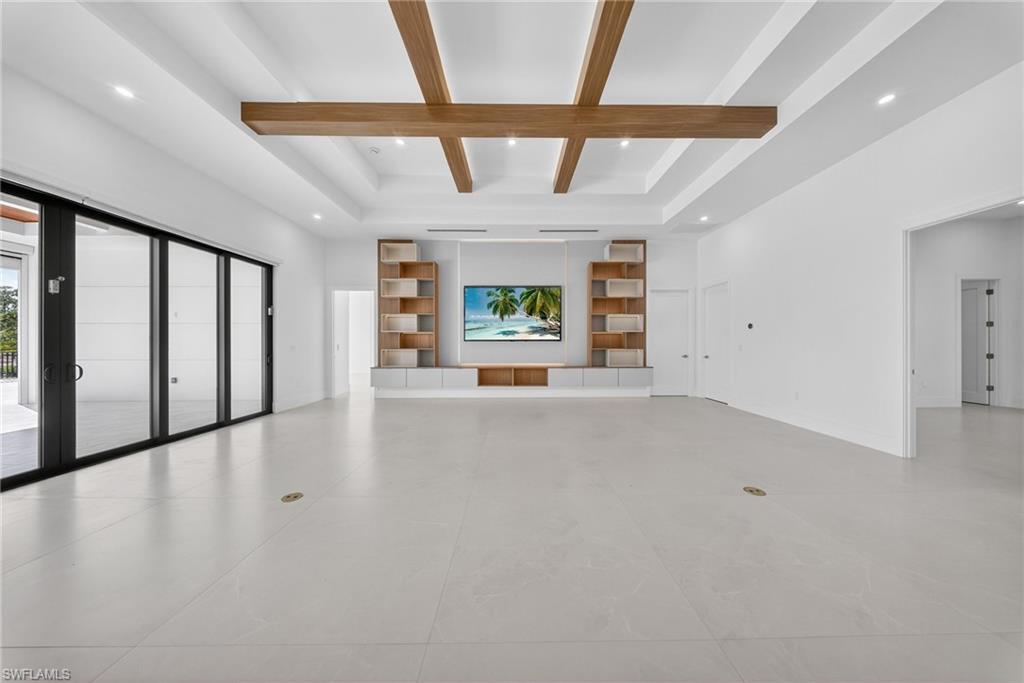1874 39th Street Southwest Naples, FL 34117 - Photo 14 of 50 an empty room with windows