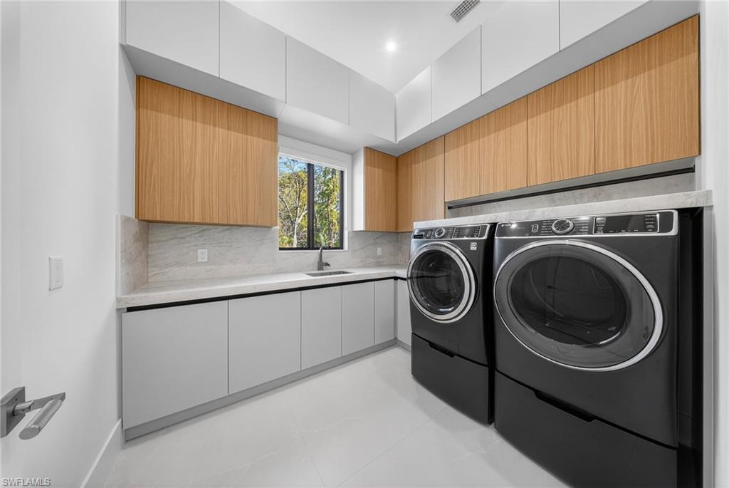 1874 39th Street Southwest Naples, FL 34117 - Photo 15 of 50 a utility room with sink dryer and washer