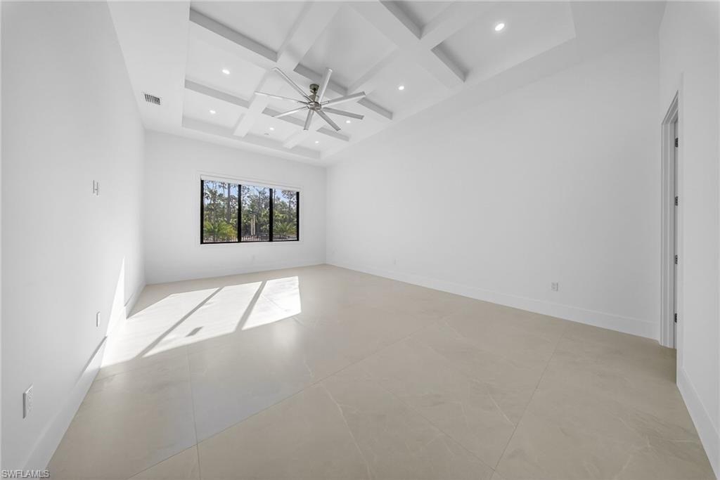 1874 39th Street Southwest Naples, FL 34117 - Photo 17 of 50 wooden floor in an empty room with a window