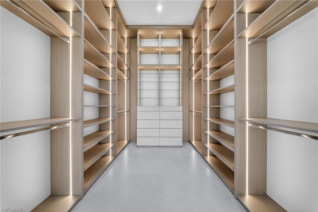 1874 39th Street Southwest Naples, FL 34117 - Photo 22 of 50 a view of walk in closet with empty racks