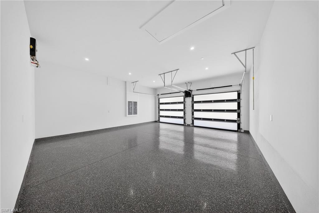 1874 39th Street Southwest Naples, FL 34117 - Photo 23 of 50 an empty room with windows and entrance