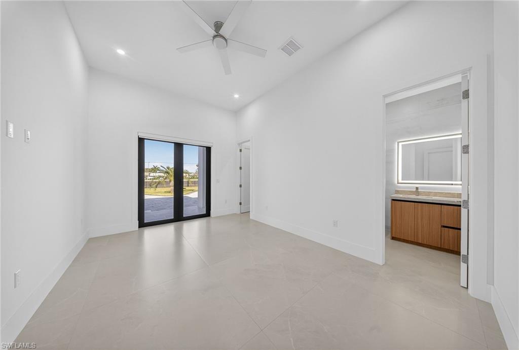 1874 39th Street Southwest Naples, FL 34117 - Photo 27 of 50 wooden floor in an empty room and a window