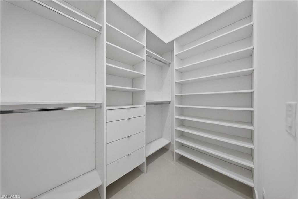 1874 39th Street Southwest Naples, FL 34117 - Photo 33 of 50 a view of walk in closet with empty racks