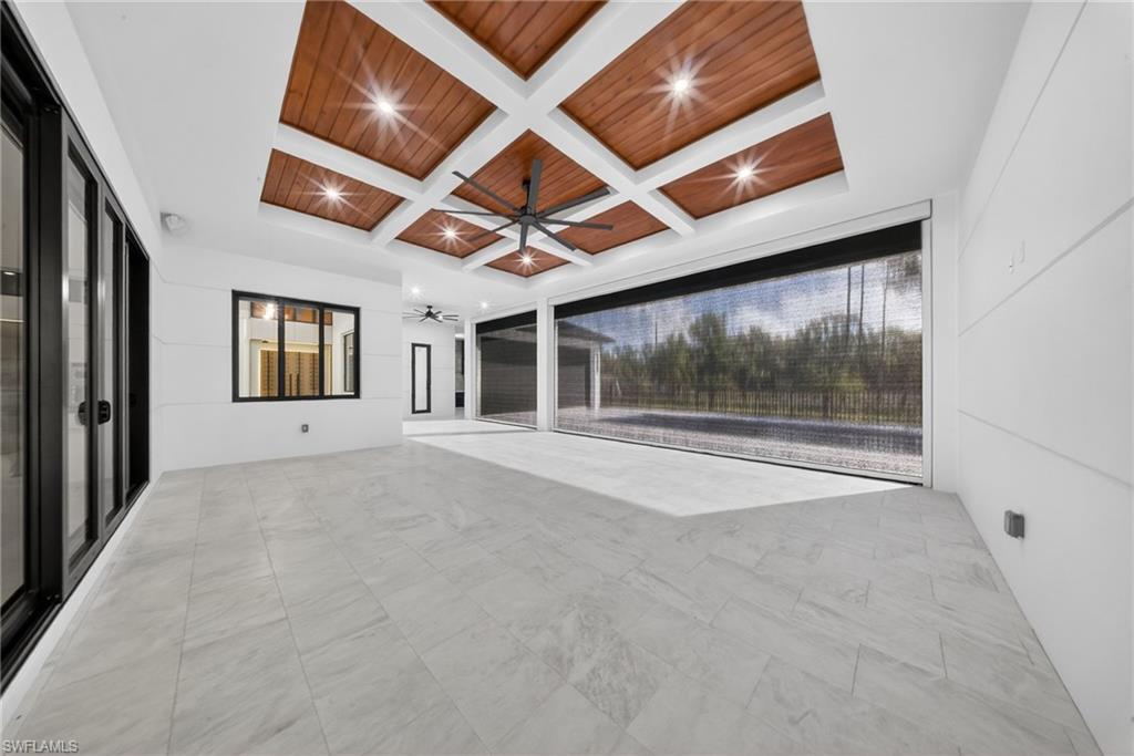 1874 39th Street Southwest Naples, FL 34117 - Photo 35 of 50 a view of an empty room with a window and a ceiling fan