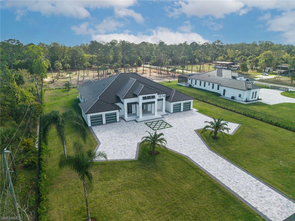 1874 39th Street Southwest Naples, FL 34117 - Photo 5 of 50 a aerial view of a house with garden