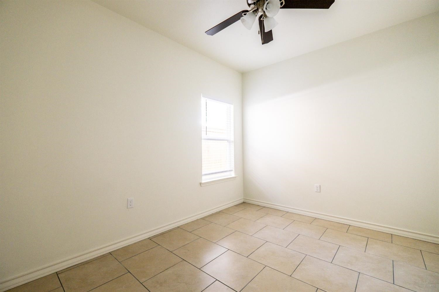 2311 20th Street Lubbock, TX 79411 - Photo 12 of 18 a view of empty room with windows