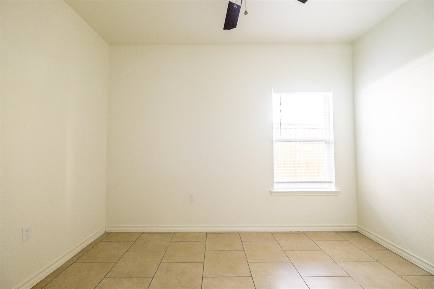 2311 20th Street Lubbock, TX 79411 - Photo 13 of 18 an empty room with windows