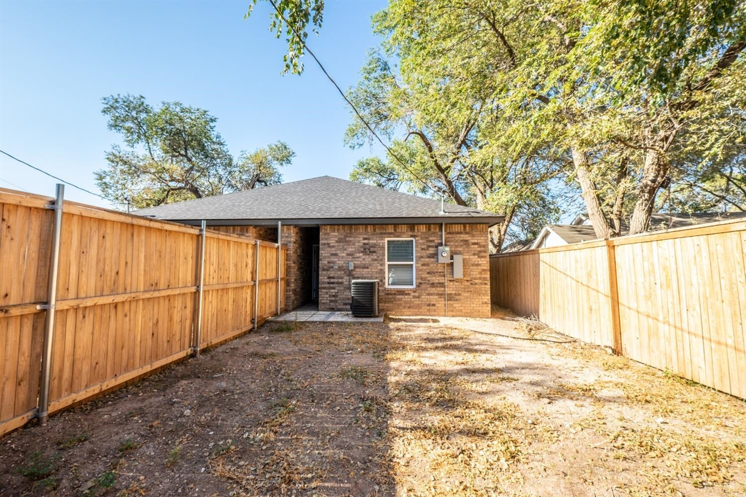 2311 20th Street Lubbock, TX 79411 - Photo 18 of 18 a view of a backyard with a large tree