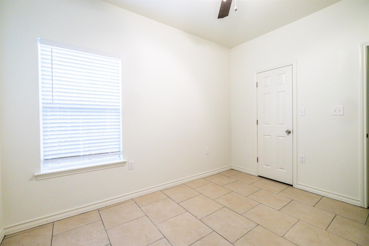 2311 20th Street Lubbock, TX 79411 - Photo 10 of 18 an empty room with windows