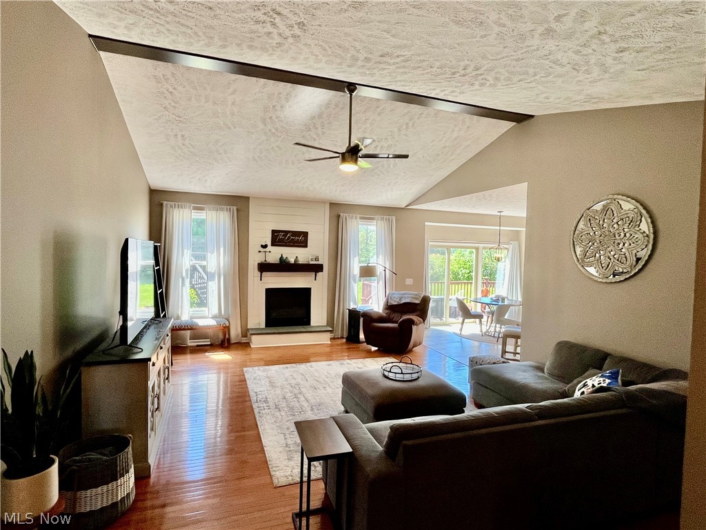 4842 Ridge Road Medina, OH 44256 - Photo 5 of 50 Fantastic great room with the fireplace in a vaulted ceiling open to the eat-in kitchen.