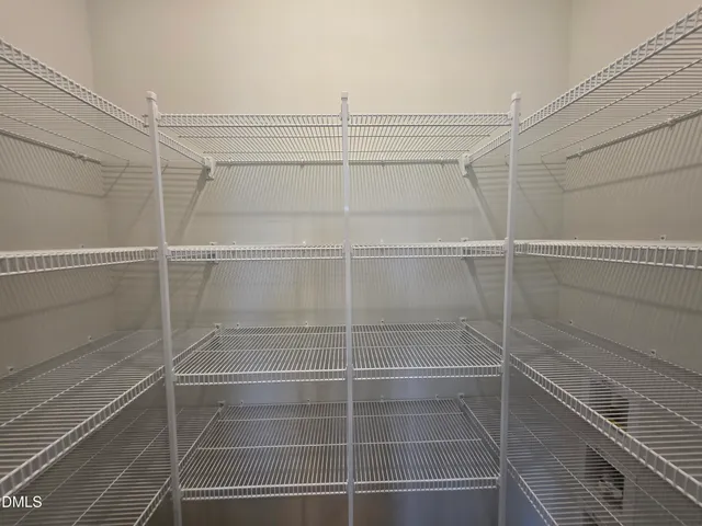 a kitchen with stainless steel appliances granite countertop a sink stove microwave and refrigerator