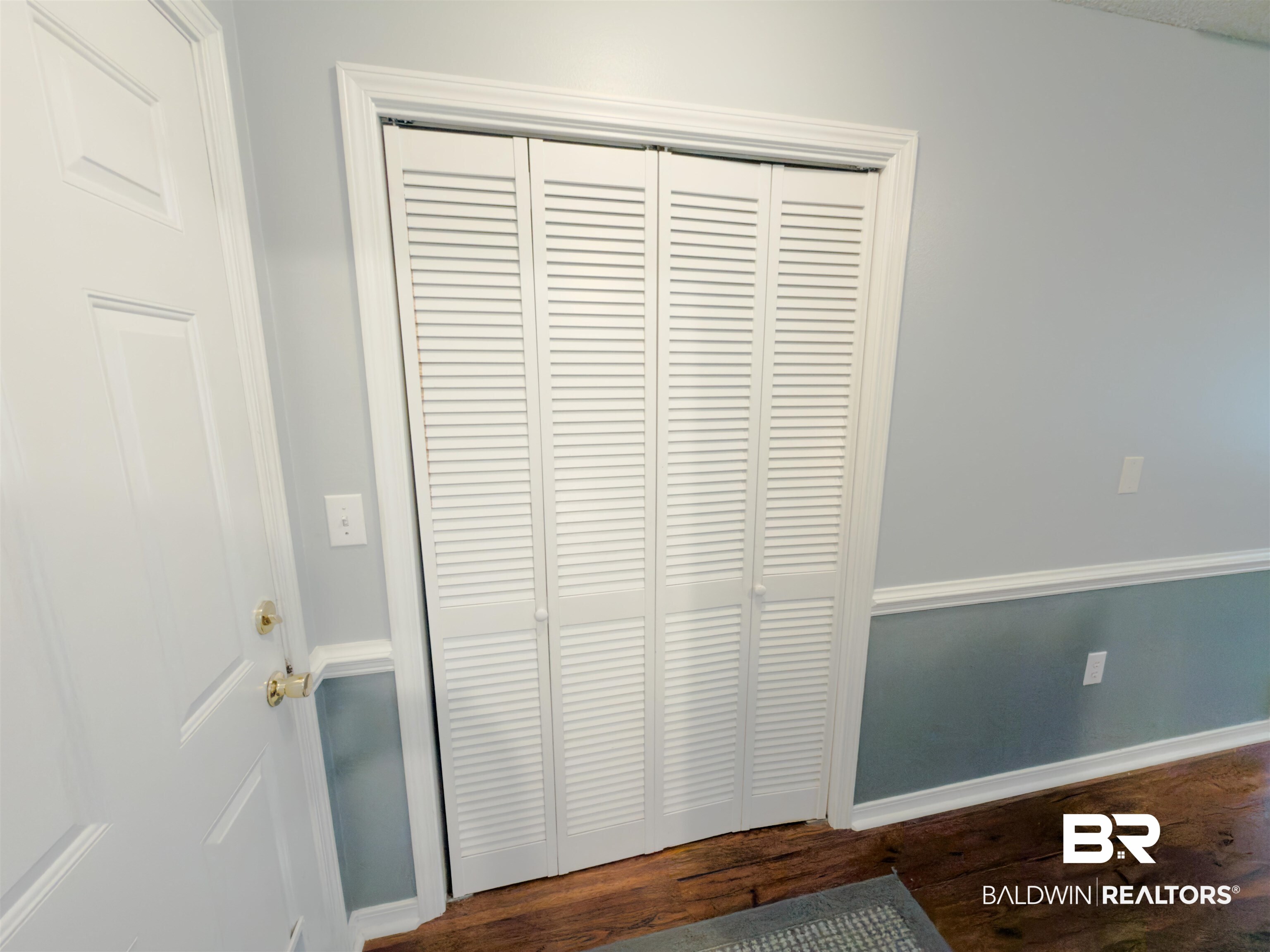 129 Pennbrooke Loop Foley, AL 36535 - Photo 32 of 44 Detailed view of wood finished floors and baseboards