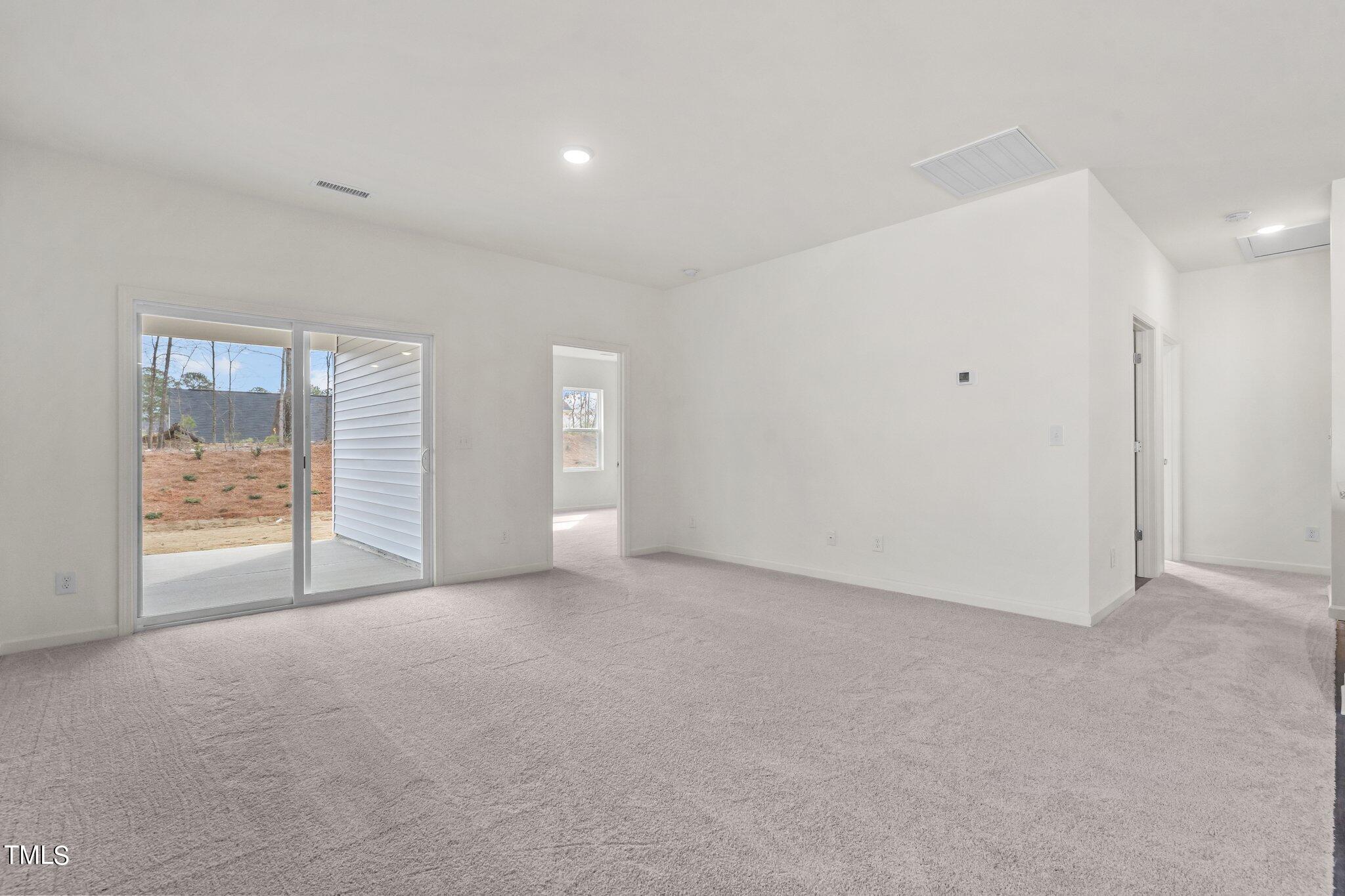 84 Club Road Louisburg, NC 27549 - Photo 12 of 28 a view of an empty room with a window